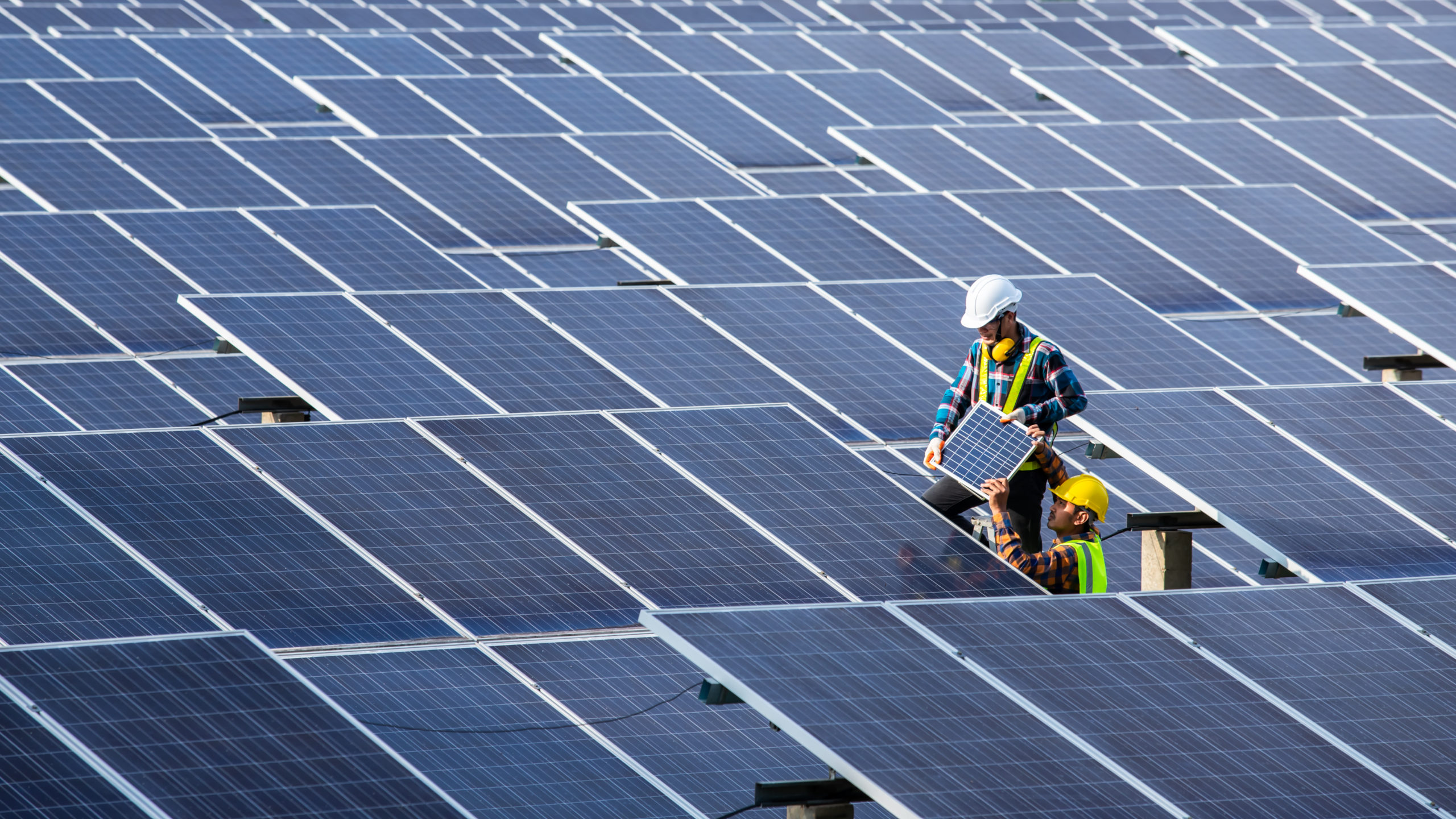 Asian engineer working on checking equipment in solar power plan